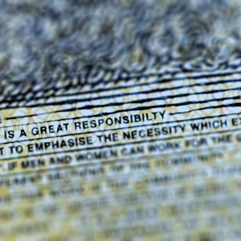 This photo illustration shows the detail in Australia's state-of-the-art new 50 dollar banknote in Sydney on May 9, 2019, with a spelling mistake in the microprint of a speech by Australia's first woman parliamentarian Edith Cowan. - The yellow and green note came into circulation last October, but it took seven months for the public to notice "responsibility" was repeatedly misspelt in the text of Cowen's maiden speech to Australia's parliament in July 1921. (Photo by Peter PARKS / AFP) / --- RESTRICTED TO EDITORIAL USE ---        (Photo credit should read PETER PARKS/AFP/Getty Images)